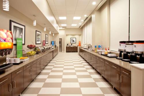 a large kitchen with long counters at Hampton Inn & Suites - Minneapolis/Downtown in Minneapolis