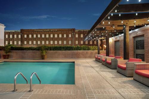 a swimming pool on the roof of a building at Hilton Garden Inn New Orleans Convention Center in New Orleans