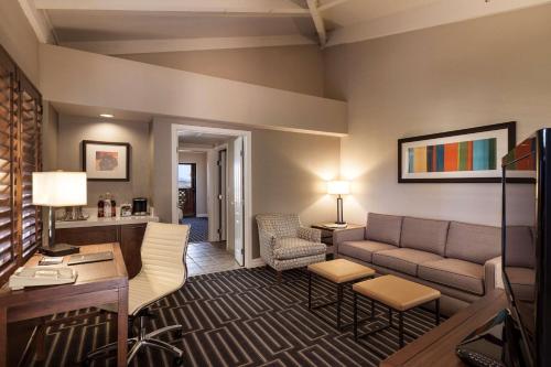 a living room with a couch and a table at Hilton Phoenix Tapatio Cliffs Resort in Phoenix