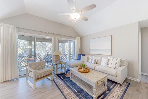 a living room with a couch and a table at Turtle Cove 5546 in Kiawah Island