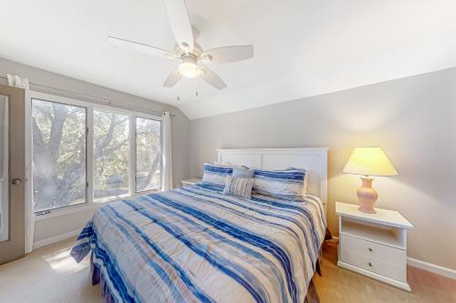 a bedroom with a bed and a ceiling fan at Turtle Cove 5546 in Kiawah Island