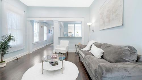 a living room with a couch and a glass table at Classic 1 Bedroom Apt in Midtown, ATL in Atlanta