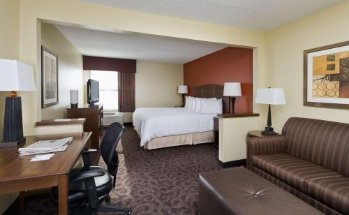 a hotel room with a bed and a desk at Hampton Inn San Angelo in San Angelo