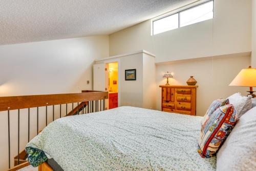 a bedroom with a large bed and a window at Family-Friendly Fraser Condo with Heated Pool Access in Fraser