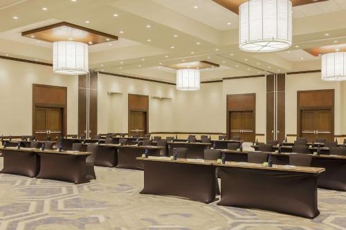 a large room with rows of tables and chairs at Embassy Suites By Hilton Syracuse Destiny USA in Syracuse