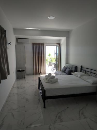 Ένα ή περισσότερα κρεβάτια σε δωμάτιο στο Creta Sun Apartments