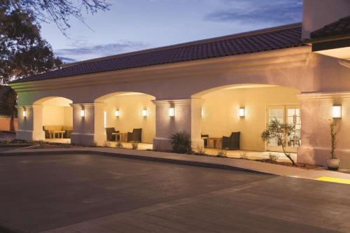 an empty parking lot in front of a building at Homewood Suites Tucson St. Philip's Plaza University in Tucson