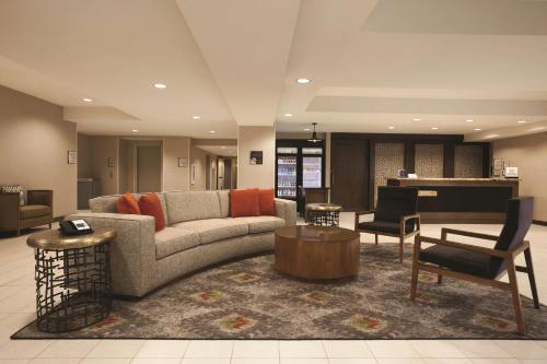 a living room with a couch and a table at Homewood Suites Tucson St. Philip's Plaza University in Tucson