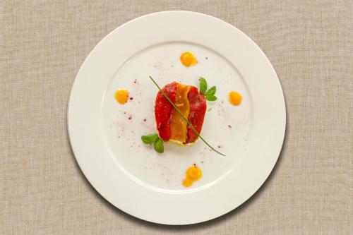 a white plate with a piece of food on it at Agriturismo Giorgio in Mattinata