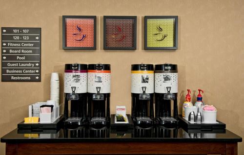a display of wine bottles on a table in a store at Hampton Inn Statesville in Statesville