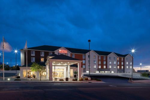 a rendering of a hotel at night at Hilton Garden Inn Albuquerque Airport in Albuquerque