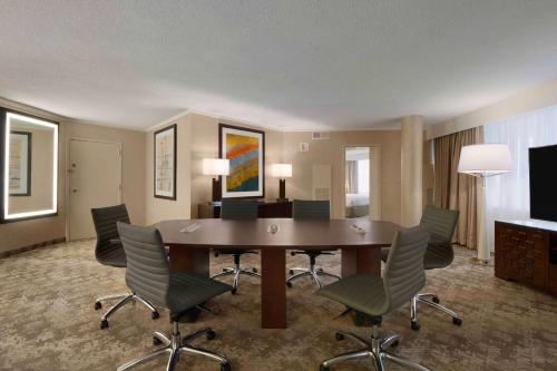 a conference room with a table and chairs at Embassy Suites by Hilton Baltimore at BWI Airport in Linthicum Heights