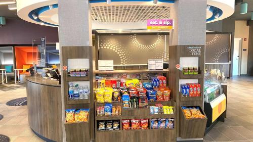 a store with a display of food and drinks at Tru By Hilton Baltimore Harbor East in Baltimore