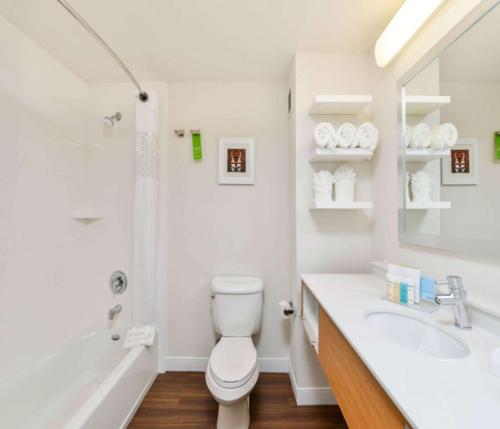 a white bathroom with a toilet and a sink at Hampton Inn & Suites San Francisco-Burlingame-Airport South in Burlingame