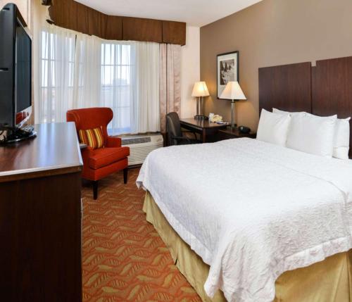 a hotel room with a large bed and a television at Hampton Inn & Suites San Francisco-Burlingame-Airport South in Burlingame