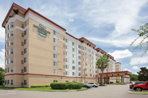 a rendering of a hotel with a parking lot at Homewood Suites by Hilton Tampa-Brandon in Tampa