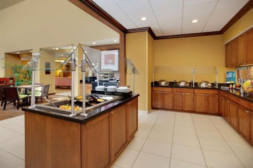 a large kitchen with a buffet in a restaurant at Homewood Suites by Hilton Tampa-Brandon in Tampa