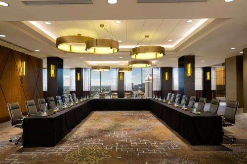 a conference room with a long table and chairs at DoubleTree by Hilton Hotel Dallas Campbell Centre in Dallas