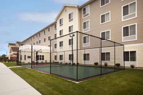 a tennis court in front of a building at Homewood Suites Atlantic City Egg Harbor Township in Egg Harbor Township