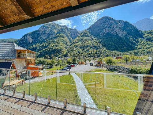 a view from the balcony of a house with mountains in the background at Villa Logu in Theth