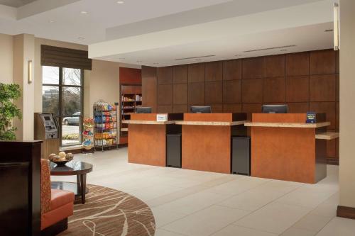 a lobby of a store with a waiting room at DoubleTree by Hilton Dulles Airport-Sterling in Sterling