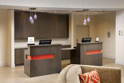 a lobby with a reception desk and a couch at Homewood Suites by Hilton Miami Downtown/Brickell in Miami