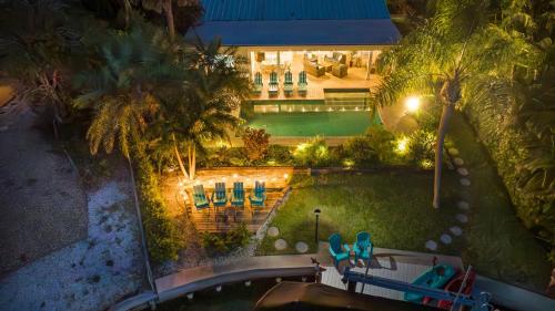 an overhead view of a pool with chairs and a house at La Contento Casa - 5560 in Siesta Key