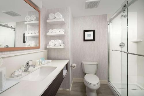 a bathroom with a toilet and a sink and a shower at Hampton Inn Marathon - Florida Keys in Marathon