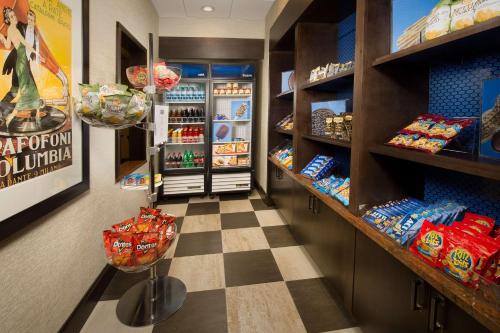 a grocery store aisle with a checkerboard floor at Hampton Inn & Suites San Antonio-Downtown/Market Square in San Antonio