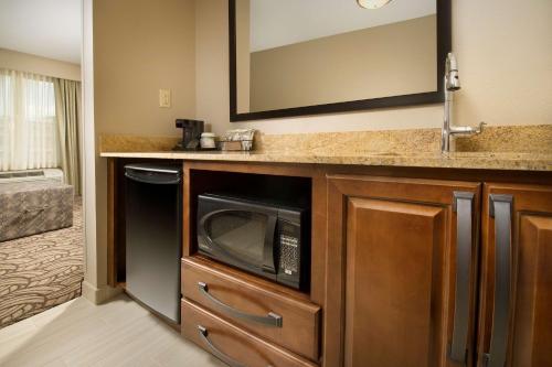 a kitchen with a microwave and a sink at Hampton Inn & Suites San Antonio-Downtown/Market Square in San Antonio