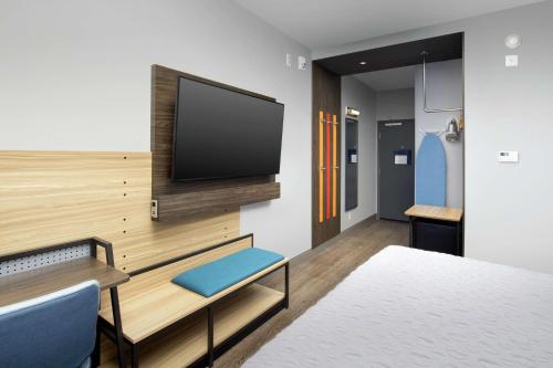 a room with a bed and a tv on a wall at Tru By Hilton San Antonio Lackland Sea World in San Antonio