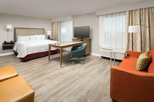 a hotel room with a bed and a desk at Hampton Inn & Suites San Antonio Lackland AFB SeaWorld in San Antonio