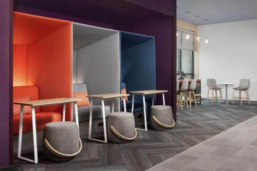 a row of tables and chairs in a room at Tru By Hilton San Antonio Lackland Sea World in San Antonio