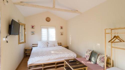 Postel nebo postele na pokoji v ubytování Köklük Wooden House