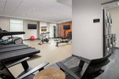 a gym with several treadmills and exercise bikes at Home2 Suites By Hilton Asheville Biltmore Village in Asheville
