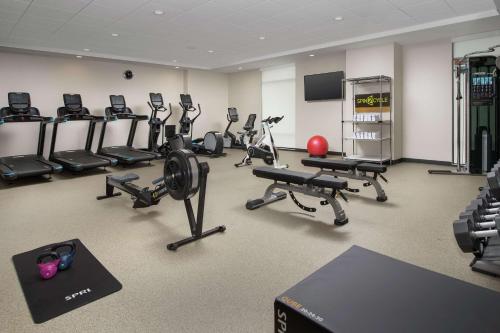 a gym with a bunch of exercise equipment in it at Home2 Suites By Hilton Asheville Biltmore Village in Asheville