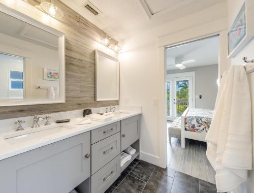 a bathroom with two sinks and a large mirror at Isla Amor - 86 in Siesta Key