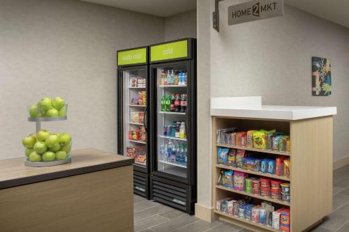 a store with two large refrigerators in a store at Home2 Suites By Hilton Edison in Edison