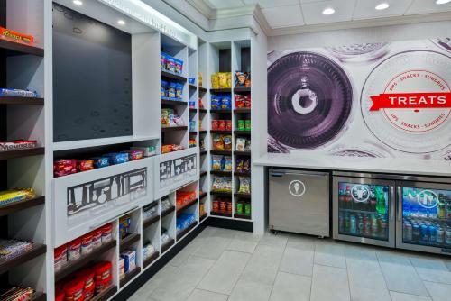 a grocery store aisle with a large poster on the wall at Hampton Inn & Suites Buffalo/Downtown in Buffalo