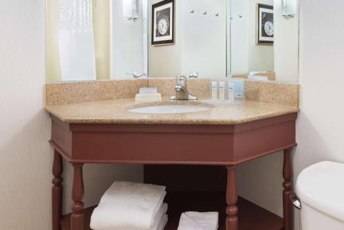 a bathroom with a sink and a mirror at Hampton Inn Danbury in Danbury