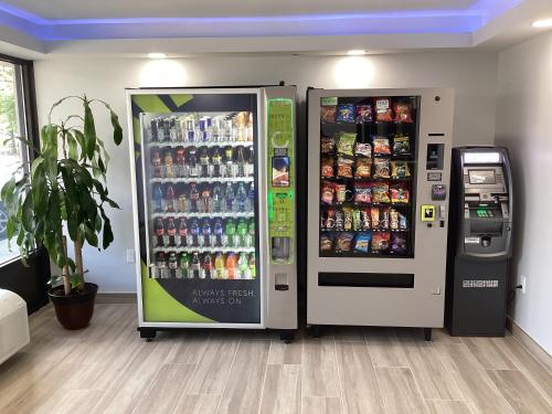 two vending machines in a room with drinks at Days-Inn by Wyndham Baltimore Northwest in Baltimore