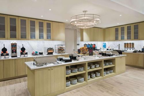 a kitchen with a counter with dishes on it at Homewood Suites by Hilton Sarasota-Lakewood Ranch in Sarasota