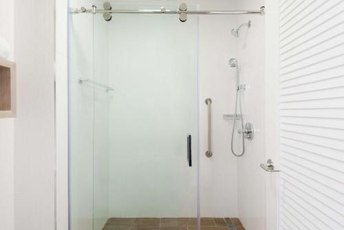 a shower with a glass door in a bathroom at Homewood Suites by Hilton Sarasota-Lakewood Ranch in Sarasota