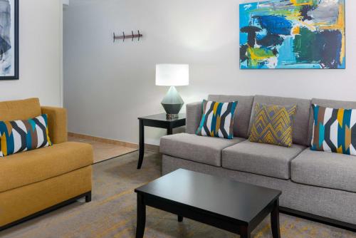 a living room with two couches and a coffee table at Hampton Inn and Suites Sarasota/Lakewood Ranch in Sarasota