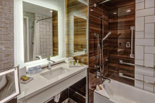 a bathroom with a sink and a shower at Hilton Franklin Cool Springs in Franklin
