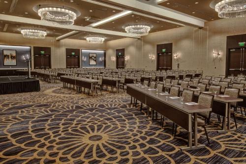 a banquet hall with rows of tables and chairs at Hilton Franklin Cool Springs in Franklin