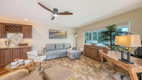 a living room with a couch and a table at Gulf Birdie - 5551 in Siesta Key