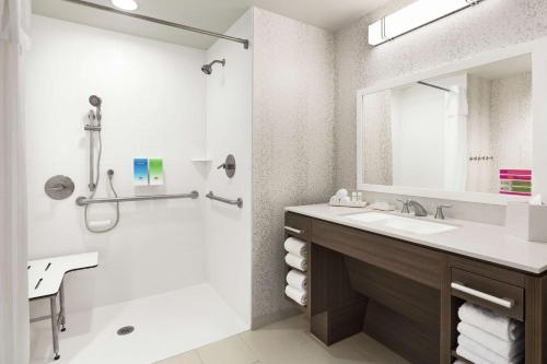 a bathroom with a sink and a shower at Home2 Suites By Hilton Colorado Springs South, Co in Colorado Springs