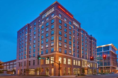 a large building on a street with a traffic light at Hampton Inn & Suites Nashville Downtown Capitol View, Tn in Nashville