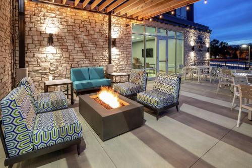 a patio with chairs and a fire pit at Homewood Suites By Hilton Edina Minneapolis in Edina